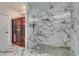Modern bathroom featuring a large shower with marble tile and glass door at 2101 Diamond Bar Dr, Las Vegas, NV 89117