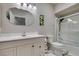 Bathroom featuring a large mirror, white cabinets and shower with glass door at 2101 Diamond Bar Dr, Las Vegas, NV 89117