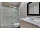 Clean bathroom featuring a shower and tub combination, a white vanity, and a modern sink at 2101 Diamond Bar Dr, Las Vegas, NV 89117