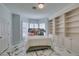 Bright bedroom featuring large windows, marble floors, and built-in shelving at 2101 Diamond Bar Dr, Las Vegas, NV 89117