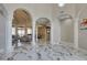 Grand foyer showcasing marble floors, open floor plan and decorative columns leading into the living and dining areas at 2101 Diamond Bar Dr, Las Vegas, NV 89117