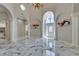 Spacious foyer features high ceilings, marble floors, white columns and front entry door with sidelight windows at 2101 Diamond Bar Dr, Las Vegas, NV 89117