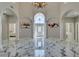 Spacious foyer features high ceilings, marble floors, white columns, and views into adjacent rooms at 2101 Diamond Bar Dr, Las Vegas, NV 89117