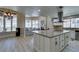 Bright, open kitchen with granite countertops, stainless steel appliances, and views of the backyard at 2101 Diamond Bar Dr, Las Vegas, NV 89117
