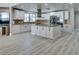 Spacious kitchen with white cabinets, stainless steel appliances, and large center island at 2101 Diamond Bar Dr, Las Vegas, NV 89117