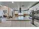 Updated kitchen features an island with granite countertops, stainless steel appliances, and ample cabinet space at 2101 Diamond Bar Dr, Las Vegas, NV 89117