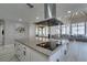 Bright, updated kitchen featuring an island with a cooktop and views of the outdoor seating area at 2101 Diamond Bar Dr, Las Vegas, NV 89117