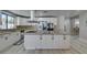Spacious kitchen featuring white cabinetry, granite countertops, stainless steel appliances, and a functional center island at 2101 Diamond Bar Dr, Las Vegas, NV 89117