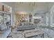 Open-concept living room featuring marble floors and seamless access to the kitchen and dining areas at 2101 Diamond Bar Dr, Las Vegas, NV 89117