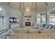 Comfortable living room with a fireplace, vaulted ceilings, and marble floors at 2101 Diamond Bar Dr, Las Vegas, NV 89117