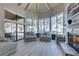 Open living room with vaulted ceilings, fireplace, and views of the backyard pool and landscaping at 2101 Diamond Bar Dr, Las Vegas, NV 89117