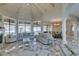 Bright living room boasts high ceilings, marble floors, large windows, and elegant furnishings at 2101 Diamond Bar Dr, Las Vegas, NV 89117