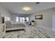 Airy main bedroom with office space, marble flooring and neutral decor at 2101 Diamond Bar Dr, Las Vegas, NV 89117