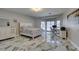 Well-lit main bedroom boasting marble floors and a convenient work space at 2101 Diamond Bar Dr, Las Vegas, NV 89117