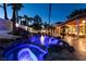 Inviting pool area with luxurious spa and tropical landscaping at 2101 Diamond Bar Dr, Las Vegas, NV 89117