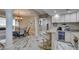Stylish wet bar area with granite counters, wine storage, and seamless access to the dining room at 2101 Diamond Bar Dr, Las Vegas, NV 89117