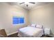 Cozy bedroom with hardwood floors, window with blinds, and modern nightstands at 2158 High Mesa Dr, Henderson, NV 89012