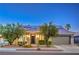 Beautiful single-story home featuring desert landscaping, solar panels, and a two-car garage at 2158 High Mesa Dr, Henderson, NV 89012