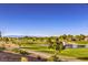 Scenic view of a golf course, pond, and water fountain at 2158 High Mesa Dr, Henderson, NV 89012