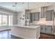 Bright kitchen featuring a large island, stainless steel appliances and pendant lighting at 2158 High Mesa Dr, Henderson, NV 89012
