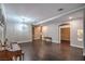 Spacious living room featuring hardwood floors, plantation shutters, and decorative chandelier at 2158 High Mesa Dr, Henderson, NV 89012