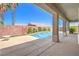 Stunning backyard pool and patio, framed by lush landscaping, perfect for outdoor entertaining at 2158 High Mesa Dr, Henderson, NV 89012