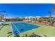 A clean, well-maintained tennis court surrounded by trees on a sunny day at 2158 High Mesa Dr, Henderson, NV 89012