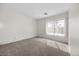 Bedroom features carpet and a large window with vertical blinds at 2329 Sunrise Meadows Dr, Las Vegas, NV 89134