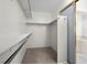 Walk-in closet featuring built-in shelving and access to an ensuite bathroom at 2329 Sunrise Meadows Dr, Las Vegas, NV 89134