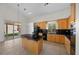 Bright kitchen with granite countertops, an island, modern appliances, and seamless access to the outdoors at 2329 Sunrise Meadows Dr, Las Vegas, NV 89134