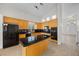 Well-appointed kitchen featuring black appliances, sleek countertops, ample cabinet space, and a functional island at 2329 Sunrise Meadows Dr, Las Vegas, NV 89134