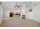 Open-concept living area flows seamlessly into a kitchen and includes a fireplace and staircase at 2329 Sunrise Meadows Dr, Las Vegas, NV 89134