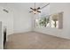 Spacious living area features large windows, neutral tile flooring, and ample natural light, creating a warm and inviting ambiance at 2329 Sunrise Meadows Dr, Las Vegas, NV 89134