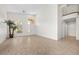 Spacious living room featuring a large window, neutral flooring, and elegant staircase leading to the upper level at 2329 Sunrise Meadows Dr, Las Vegas, NV 89134