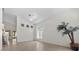 Bright living area with large window, neutral tile flooring, and ample space for relaxation and entertaining at 2329 Sunrise Meadows Dr, Las Vegas, NV 89134