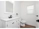 Bathroom featuring a stylish vanity with sink, toilet, and window, complete with modern fixtures at 25 Blue Valley Dr, Henderson, NV 89002