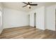 A bedroom featuring wood floors, a ceiling fan, and a closet with sliding doors at 25 Blue Valley Dr, Henderson, NV 89002