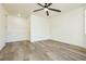 This bedroom features hardwood floors, a ceiling fan, and a large closet at 25 Blue Valley Dr, Henderson, NV 89002