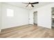 A cozy bedroom with hardwood floors, a closet, and a bright atmosphere, providing a comfortable living space at 25 Blue Valley Dr, Henderson, NV 89002