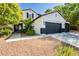 Two-story home with a well-manicured front yard and a double-door entryway at 25 Blue Valley Dr, Henderson, NV 89002
