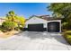 Charming home featuring a three-car garage, well-maintained landscaping, and inviting curb appeal at 25 Blue Valley Dr, Henderson, NV 89002