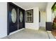 Front entrance featuring double doors with decorative glass inserts and black trim at 25 Blue Valley Dr, Henderson, NV 89002