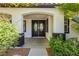 Inviting front entrance with double doors and manicured landscaping at 25 Blue Valley Dr, Henderson, NV 89002