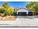 Charming two-story home with a three-car garage and well-maintained landscaping at 25 Blue Valley Dr, Henderson, NV 89002