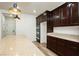 Stylish kitchen boasting granite countertops, island and wood-look flooring at 25 Blue Valley Dr, Henderson, NV 89002