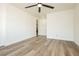 A bright and airy living room featuring wood floors and a ceiling fan at 25 Blue Valley Dr, Henderson, NV 89002