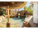 Backyard paradise showcasing a beautiful pool with a waterfall feature and lush landscaping, perfect for relaxation at 25 Blue Valley Dr, Henderson, NV 89002