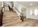 View of entry showing beautiful light wood staircase with dark stained bannister at 25 Blue Valley Dr, Henderson, NV 89002