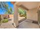 An airy back patio area offers desert landscaping and direct backyard access via a sliding glass door at 2550 Evening Twilight Ave, Henderson, NV 89044