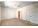 Bedroom with neutral walls and carpet, ceiling fan and access to bathroom and closet at 2550 Evening Twilight Ave, Henderson, NV 89044